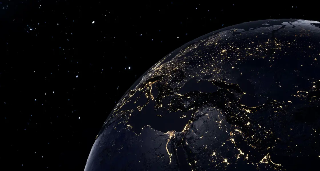 Earth from space at night, with lights spanning across Europe