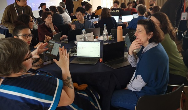 Teams working at Build a Bot event