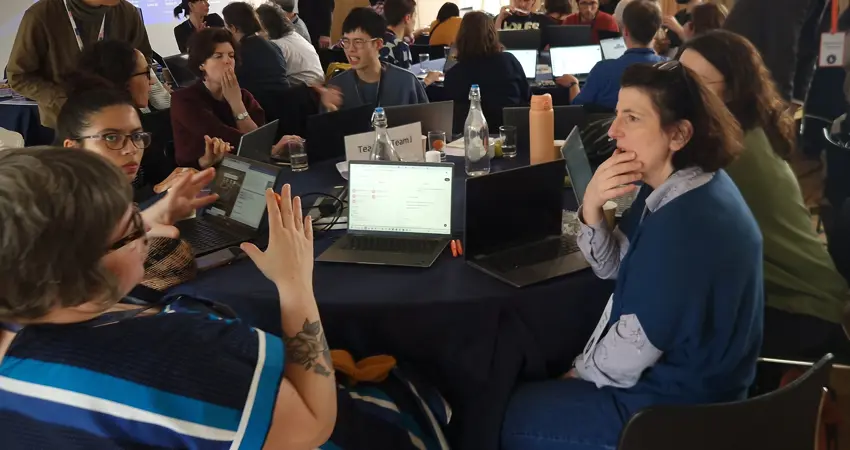 Teams working at Build a Bot event